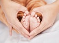 You have all my love forever. a mother creating a heart shape around her babys feet.
