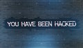 You have been hacked inscription over binary code digits background