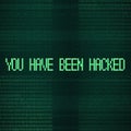 You have been hacked inscription over binary code stream background