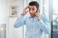 You have horrible timing. a handsome young businessman making a phone call using his smartphone.