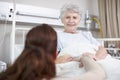 You have nothing to worry about. An affectionate daughter consoling her sick mother in the hospital. Royalty Free Stock Photo