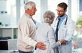 You have nothing to worry about. a doctor comforting a senior couple in a clinic. Royalty Free Stock Photo