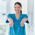 You have nothing to worry about. Portrait of a young doctor showing thumbs up in a hospital. Royalty Free Stock Photo