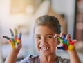 You have to get messy to get creative. Portrait of a little girl with her hands covered in paint. Royalty Free Stock Photo