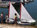 Children are learning sailing with a small boat