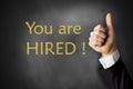You are hired chalkboard thumbs up Royalty Free Stock Photo