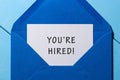 You are hiring phrase written in the paper at blue envelope. human resources concept