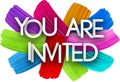 You are invited paper word sign with colorful spectrum paint brush strokes over white