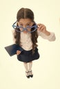 Are you kidding me. Schoolgirl heart shaped glasses isolated white background. Child girl school uniform clothes picking Royalty Free Stock Photo