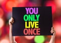 You Only Live Once card with bokeh background Royalty Free Stock Photo