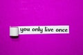 You only live once text, Inspiration, Motivation and business concept on purple torn paper Royalty Free Stock Photo