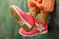 Pink is a favorite shade of many women and a pink pair of shoes style Royalty Free Stock Photo