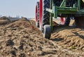 You look past a tractor at an asparagus field in Germany. The focus lies on the horizon Royalty Free Stock Photo