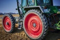 You look past a tractor at an asparagus field in Germany. The focus lies on the tractor, the horizon is somewhat out of focus in t Royalty Free Stock Photo