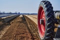 You look past a tractor at an asparagus field in Germany. Royalty Free Stock Photo