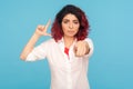 You are loser! Portrait of angry woman with fancy red hair showing L sign and pointing finger to camera