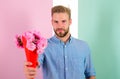 This is for you Macho gives flowers as romantic gift. Boyfriend confident holds bouquet flowers. Man ready for romantic Royalty Free Stock Photo