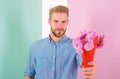 This is for you Macho gives flowers as romantic gift. Boyfriend confident holds bouquet flowers. Man ready for romantic Royalty Free Stock Photo