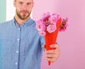 This is for you Macho gives flowers as romantic gift. Boyfriend confident holds bouquet flowers. Guy bring romantic Royalty Free Stock Photo