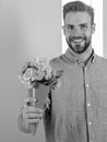 This is for you Macho gives flowers as romantic gift. Boyfriend happy holds bouquet flowers. Guy bring romantic pleasant Royalty Free Stock Photo