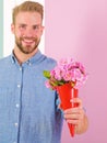 This is for you Macho gives flowers as romantic gift. Boyfriend happy holds bouquet flowers. Guy bring romantic pleasant Royalty Free Stock Photo