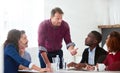 You made a great point earlier...a handsome mature businessman addressing his team during a meeting. Royalty Free Stock Photo