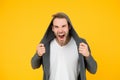 You make me angry. Angry man yellow background. Handsome guy in angry mood. Unshaven model scream with anger. Negative Royalty Free Stock Photo