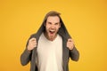 You make me angry. Angry man yellow background. Handsome guy in angry mood. Unshaven model scream with anger. Negative Royalty Free Stock Photo