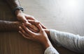 You make me a better person. a man and woman compassionately holding hands at a table. Royalty Free Stock Photo