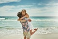 You make me so happy. an affectionate young couple embracing on the beach. Royalty Free Stock Photo