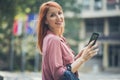 Red haired woman looking at camera. Royalty Free Stock Photo