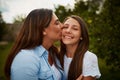 You make me so proud. a young woman kissing her young daughter on the cheek. Royalty Free Stock Photo