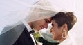 You make my world go round. an affectionate young newlywed couple sharing an intimate moment while covering themselves Royalty Free Stock Photo