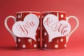 You and Me, love message greeting on heart gift tags on red polka dot coffee mugs Royalty Free Stock Photo