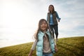 You must put their happiness ahead of your own. an attractive young woman and her daughter in the park. Royalty Free Stock Photo