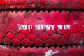 Inscription on the big old tire, colored in red. Royalty Free Stock Photo