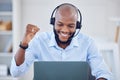 You only need your only approval. a young male call center agent cheering while using a laptop at work. Royalty Free Stock Photo