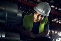 You never know whats lurking below. a young man doing inspections at a construction site.