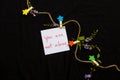 You are not alone message card handwriting with wooden star ,rope and purple flowers