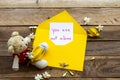 You are not alone message card handwriting in yellow envelope Royalty Free Stock Photo