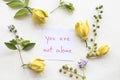 You are not alone message card handwriting with ylang flower