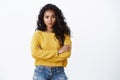 You are out of my league. Sassy confident alluring young curly-haired woman in yellow t-shirt cross arms chest and Royalty Free Stock Photo