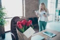 For you. Photo of beautiful blond business lady just came workplace fresh red tulips bunch 8 march surprise little Royalty Free Stock Photo