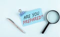 ARE YOU PREPARED text written on a sticky with magnifier and pen, business concept