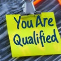 You Are Qualified Note on Clip. Generative ai. Royalty Free Stock Photo