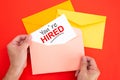 You`re Hired Concepts - Hand holding a envelope and post card Royalty Free Stock Photo