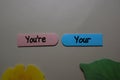 You`re, Your write on a sticky note isolated on office desk. Learning use proper grammar Royalty Free Stock Photo