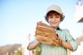 You ready. Cropped portrait of a young boy playing baseball in the yard with his father in the background. Royalty Free Stock Photo