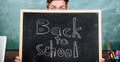 Are you ready study. Teacher or school principal welcomes inscription back to school. Teacher peeking out blackboard