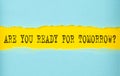 ARE YOU READY FOR TOMORROW text on the torn paper , yellow background Royalty Free Stock Photo